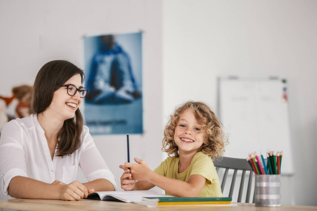 Child engaging with a psychologist in a warm and supportive environment