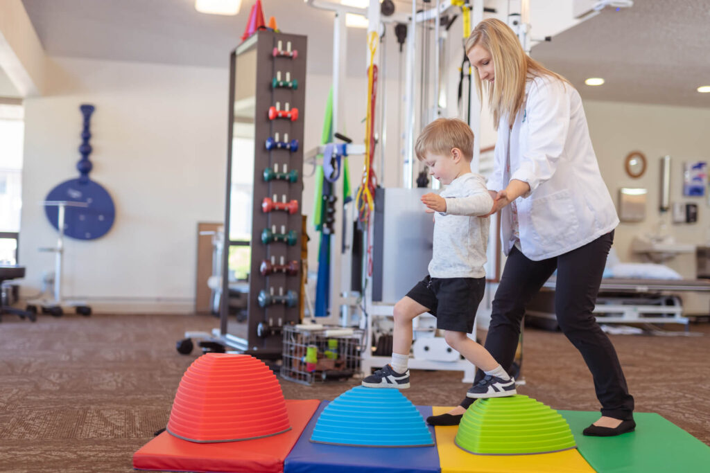 NDIS physiotherapist supporting child in therapy session at Early Start Australia